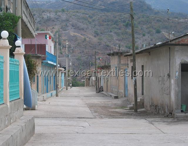 Tetelcingo_8.JPG - The towns streets have been paved. Notice in this photo the area near the first telephone pole is not paved. Each person is responsible to pay for the work or the materials or both, the paving there will happen but shows how recent the paving of the streets was in late January 2005.